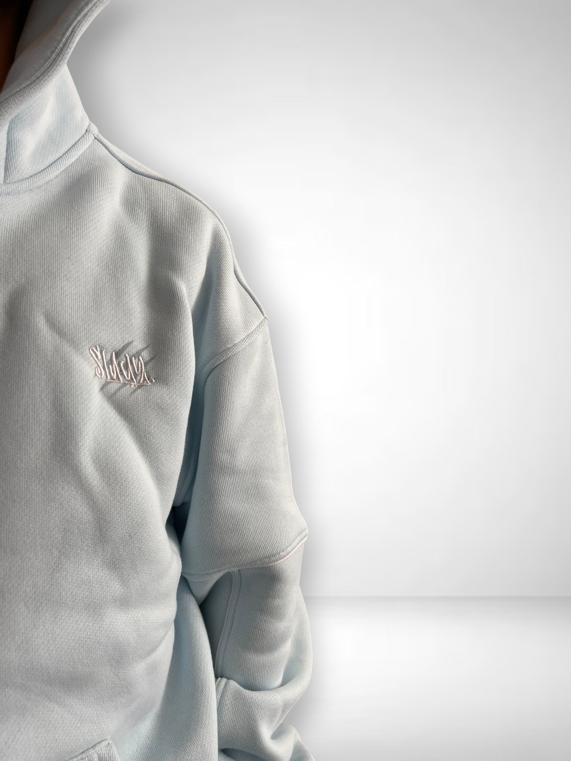 SLAYZ light blue cotton blend oversized hoodie with embroidered logo and contrast stitching.