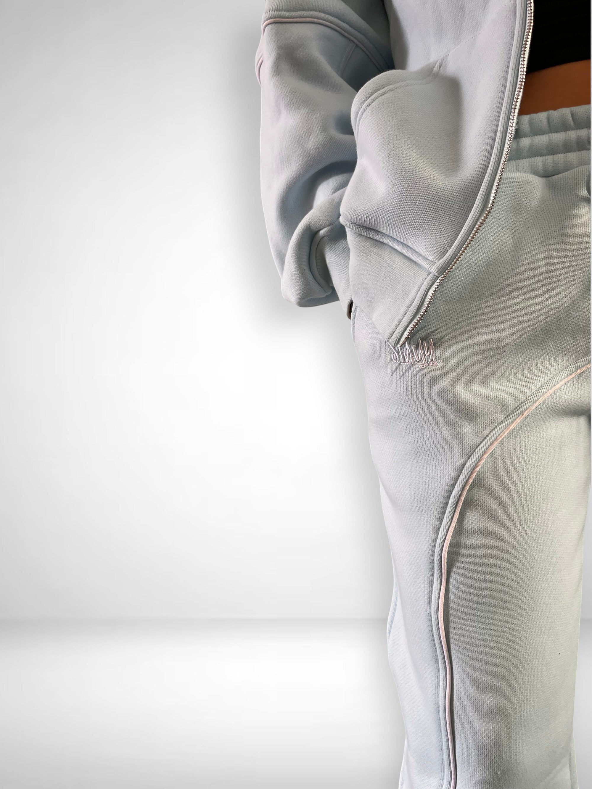 SLAYZ light blue cotton blend oversized jogging suit with zip-up hoodie and wide-leg pants, featuring contrast piping and embroidered logo.