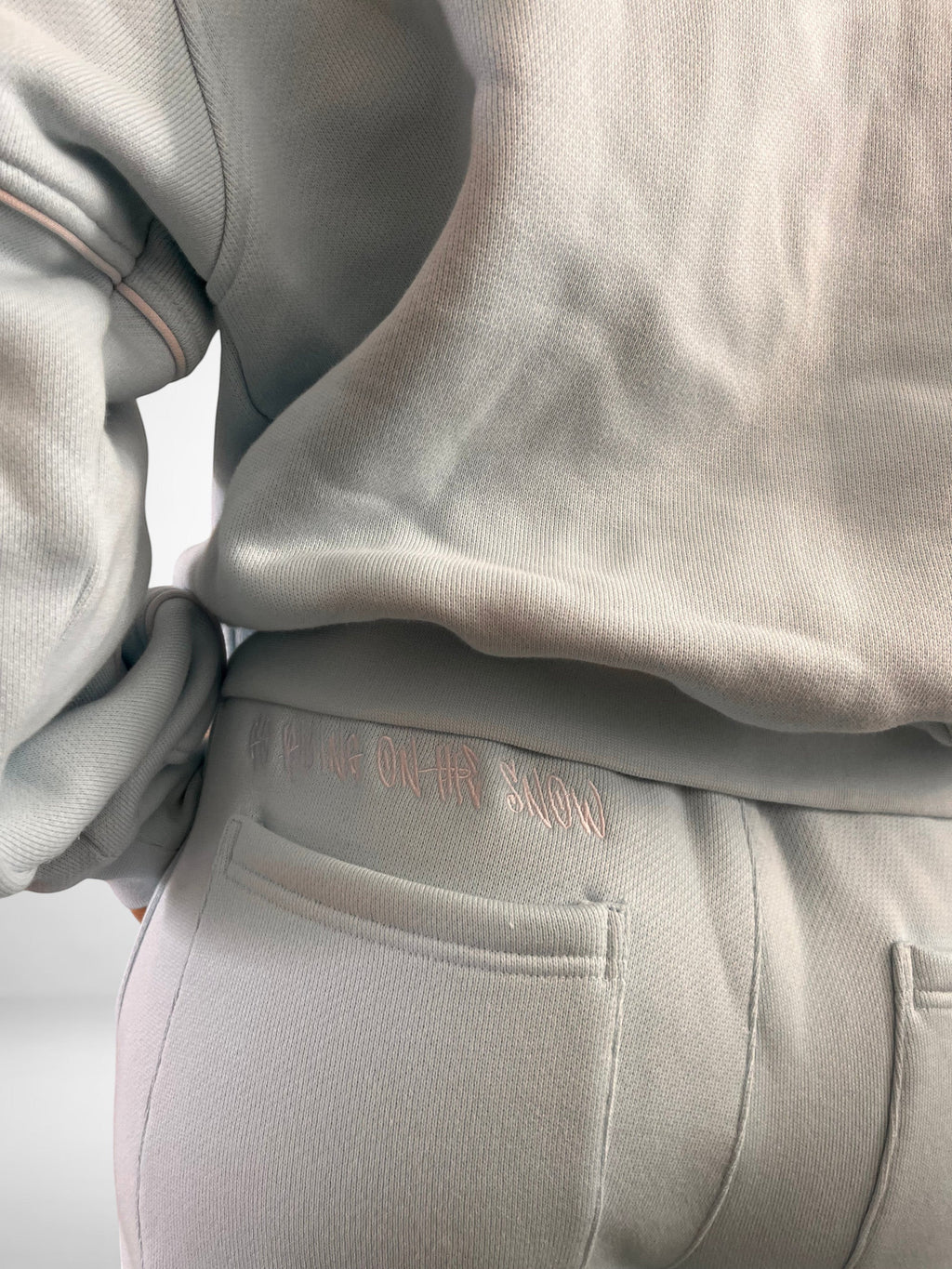 SLAYZ light blue oversized cotton blend jogging suit with embroidered text on back pocket.