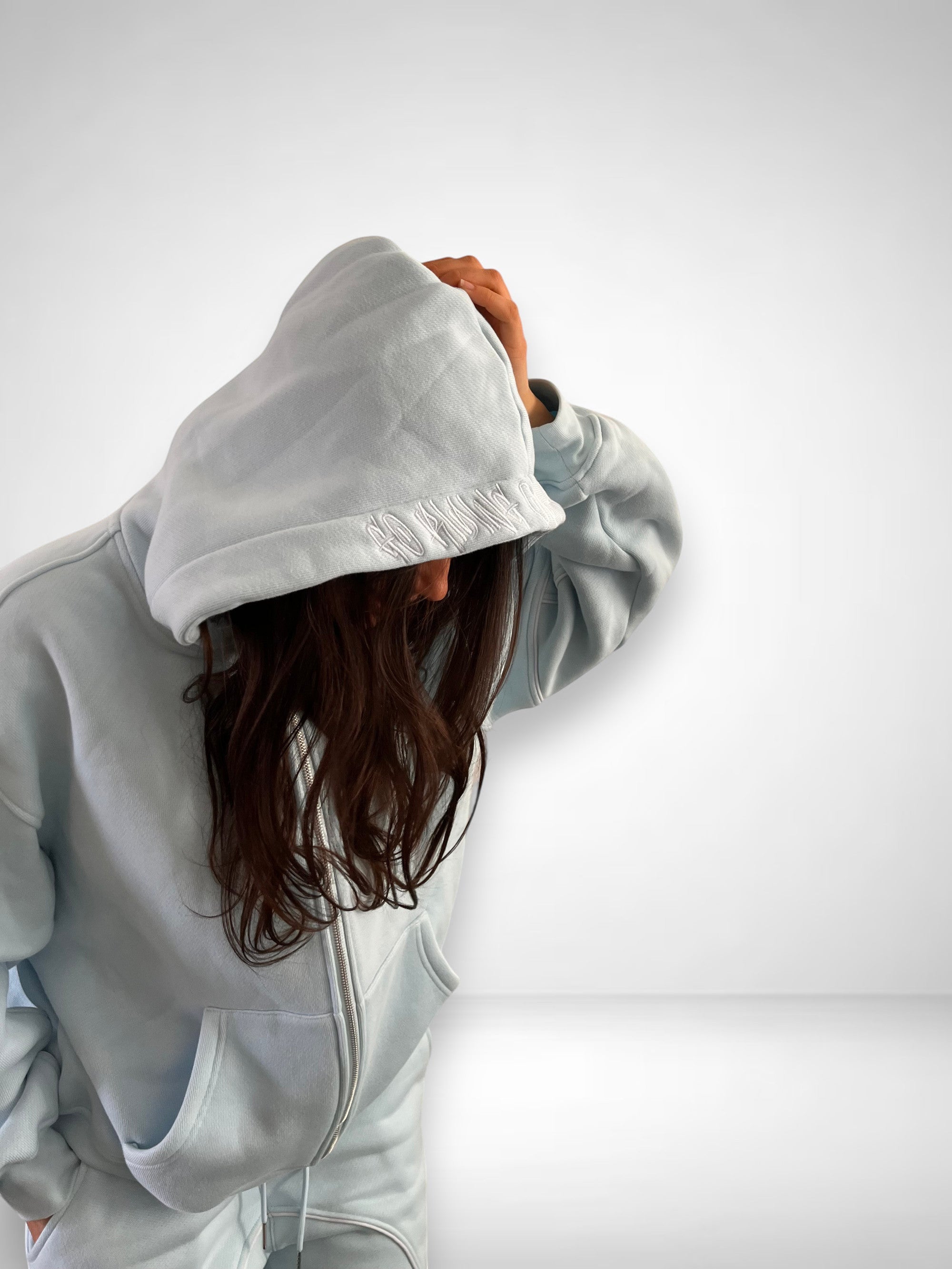 SLAYZ light blue oversized cotton blend zip-up hoodie and matching joggers with embroidered logo detail.