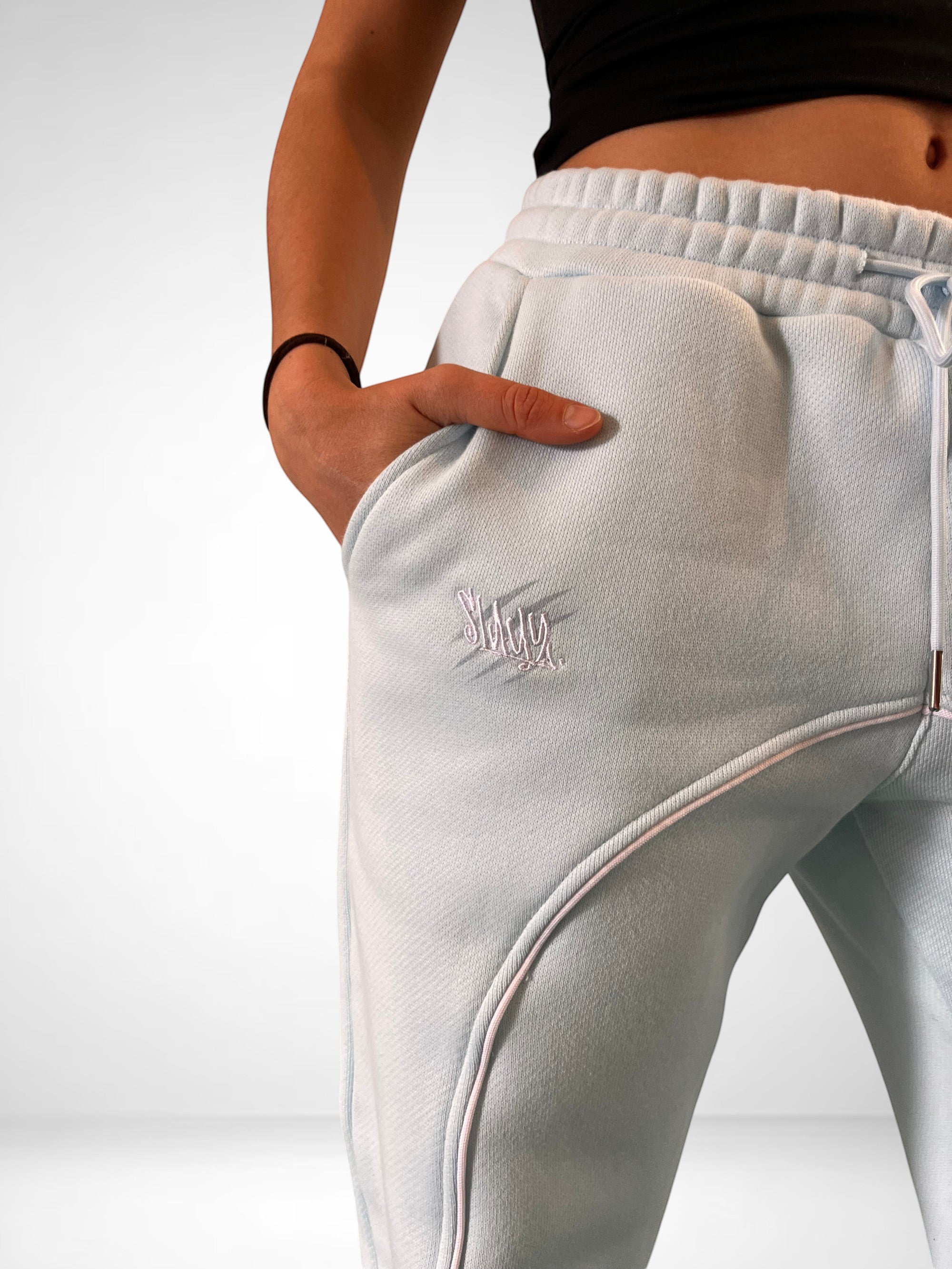 SLAYZ light blue relaxed fit sweatpants with drawstring waist and pink piping detail.