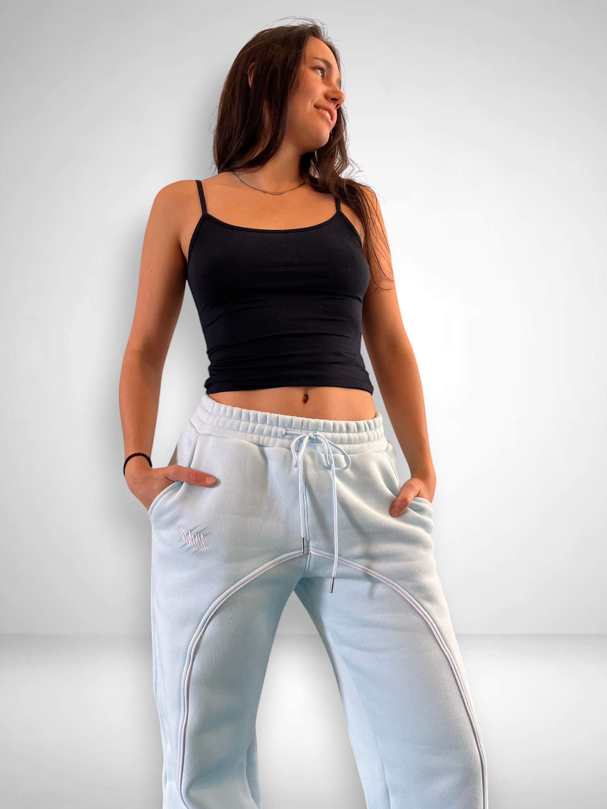 SLAYZ light blue relaxed fit sweatpants with white piping detail and adjustable drawstring waist.