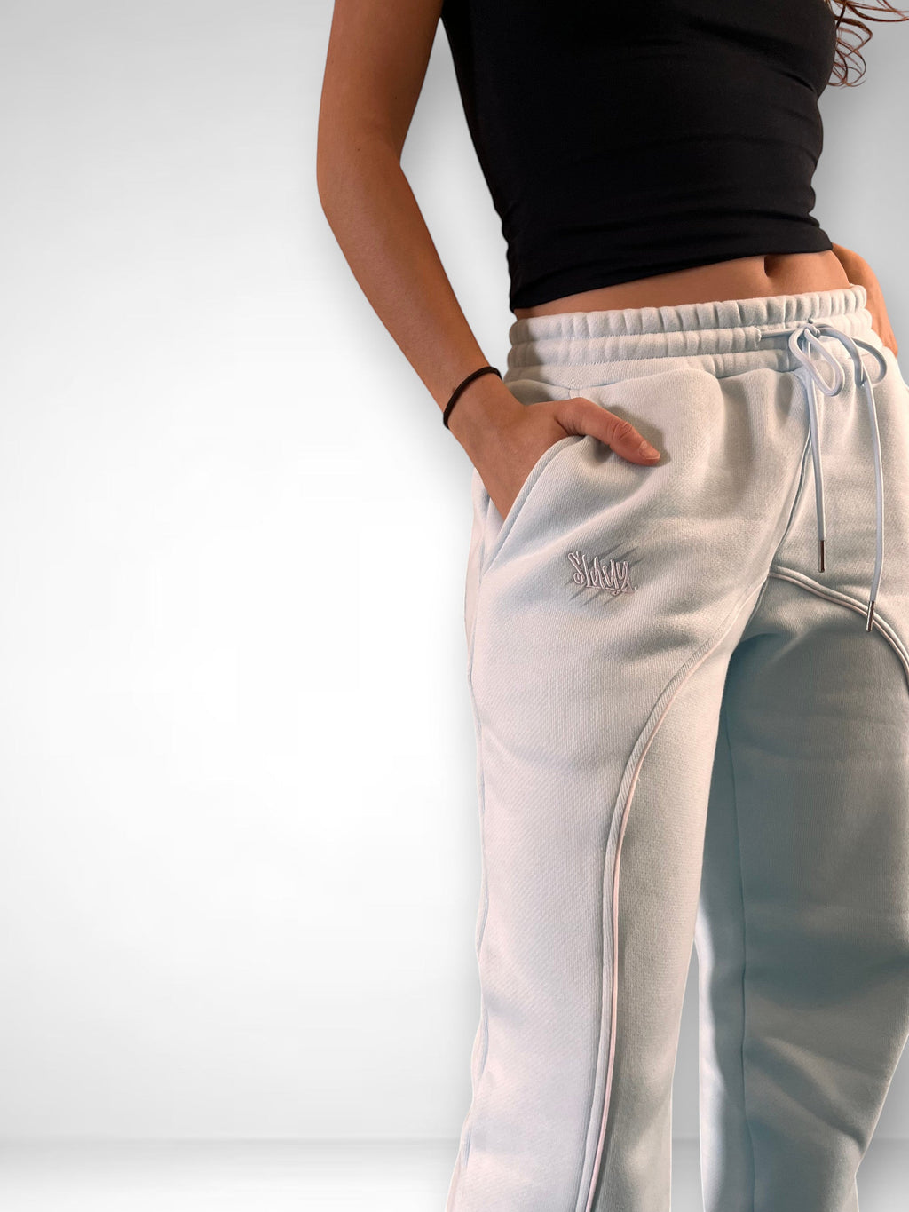 SLAYZ light blue relaxed fit sweatpants with drawstring waist and embroidered logo. Soft, comfortable fabric.